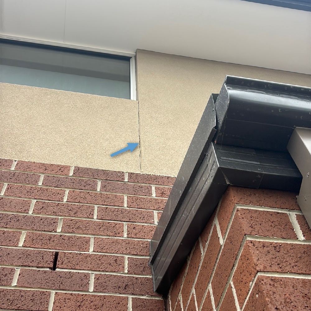 Expansion joint in the brickwork left unsealed and still holding mortar, found during a pre-handover inspection in Kalkallo