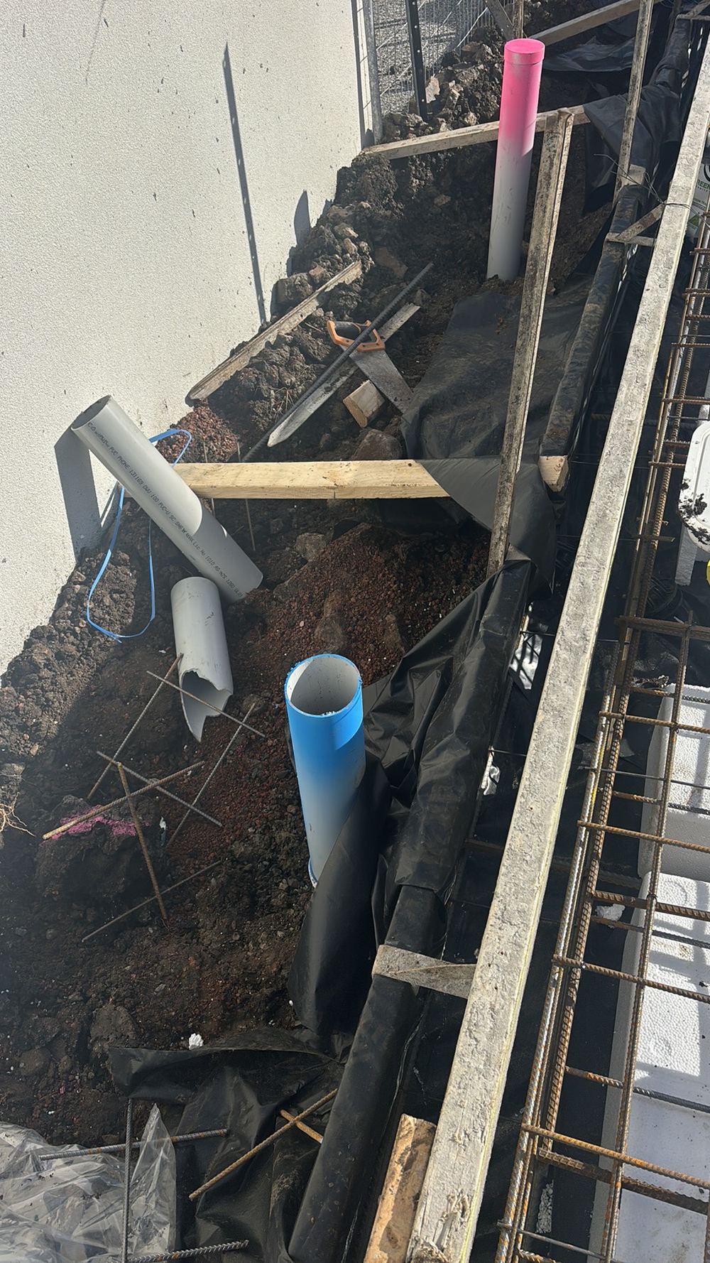 Sewer and stormwater pipe ends left open, inviting debris and later blockages, found during a slab pre-pour inspection in Kalkallo