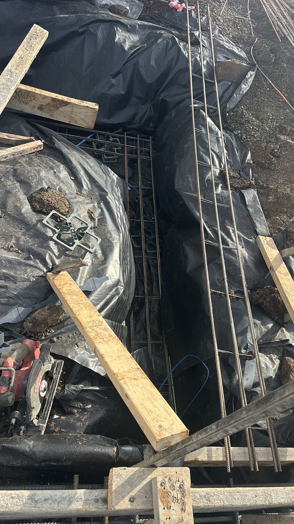 Extra top bar shown on the engineering drawings not yet tied into the beam, found during a slab pre-pour inspection in Kalkallo